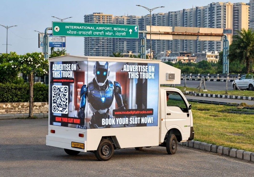 The MODO advertising truck with its L-shaped LED screen on the back and side